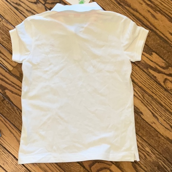 White Women’s Polo Shirt with Pink Logo - Picture 2 of 3